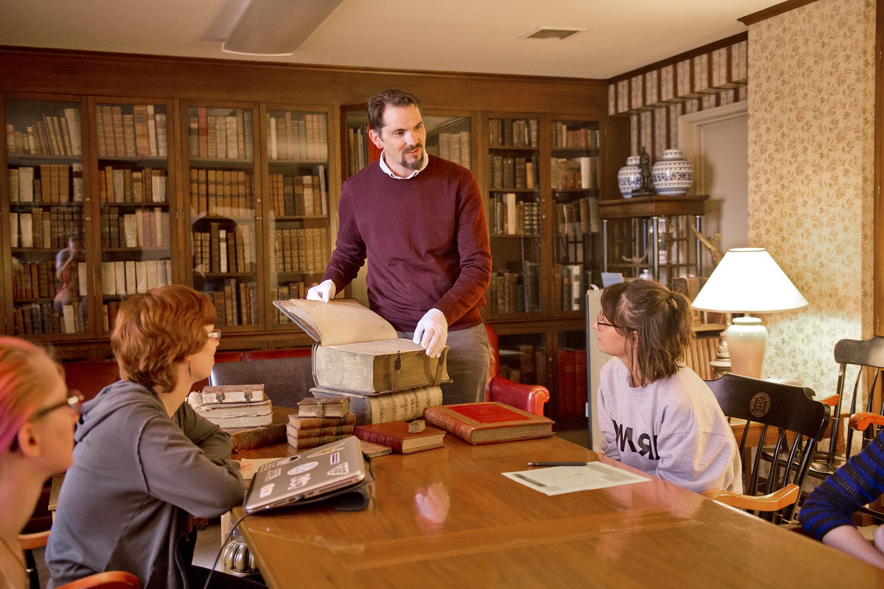 David Thiele presenting a book to students